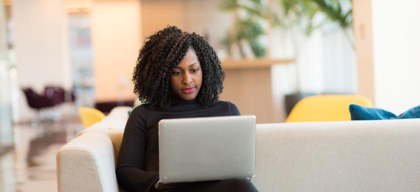 Women on couch with laptop