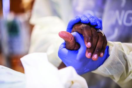 Holding patients hand