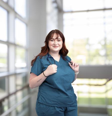 Nurse smiles at camera